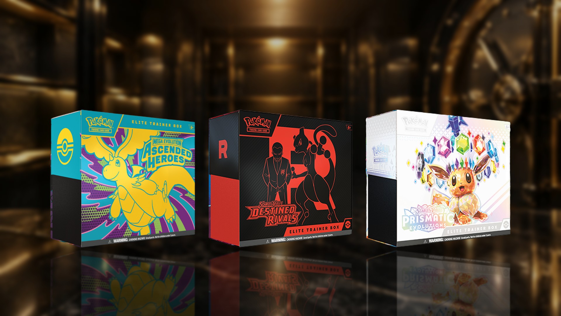 Ascended Heroes, Destined Rivals and Prismatic Evolutions Elite Trainer Boxes on a glossy vault display